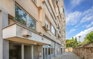 a building with windows on the side of a street at 1 Bedroom Lovely Apartment In Pula in Pula