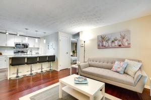 a living room with a couch and a table at Quiet Columbia Condo Near Parks and Pool! in Columbia