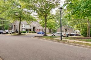a street in a residential neighborhood with cars parked at Quiet Columbia Condo Near Parks and Pool! in Columbia