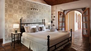 Boutique Hotel Secret Garden Granada客房内的一张或多张床位