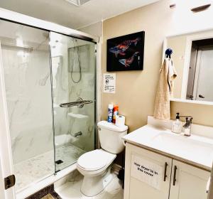 a bathroom with a shower and a toilet and a sink at Home in Downtown in Toronto +27 photos