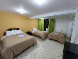 מיטה או מיטות בחדר ב-Tayta Wasi Hotel
