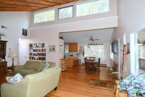 a living room with a couch and a table at Home at Last - Gather here! in Berkeley Springs