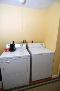 two washing machines sitting next to each other in a room at Home at Last - Gather here! in Berkeley Springs +39 photos