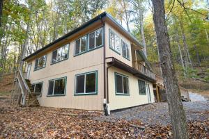 a house that is sitting in the woods at Home at Last - Gather here! in Berkeley Springs