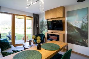 Televízia a/alebo spoločenská miestnosť v ubytovaní Apartament Górska Polana by Apart Concept Podhale + 35 fotografií