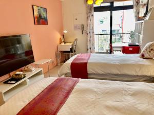 Tempat tidur dalam kamar di 心適都蘭Comfy Inn, Dulan