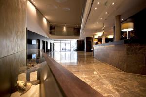 a lobby of a building with a long hallway at ATLANTIC Grand Hotel Bremen in Bremen