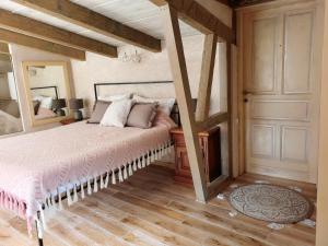 a bedroom with a bed and a wooden floor at Котор. Потрясающий вид. in Muo