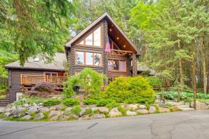 a log cabin in the woods with a garden at Magical Metamora Cottage with Fire Pit, Pond, Deck! in Metamora
