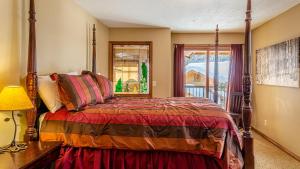 a bedroom with a bed and a window at Trails Edge #03 By Bear Country in Sun Peaks +27 photos