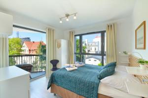 Posteľ alebo postele v izbe v ubytovaní Apartamenty Horyzont SeaView by Rent like home