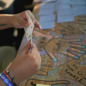 a person is playing a game on a map at Sunshot Hostel in Legian