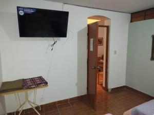 a room with a flat screen tv on a wall at CasaBlanca in Nazca