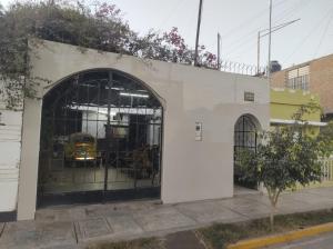 a garage with a yellow truck inside of it at CasaBlanca in Nazca