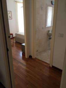 a room with a bathroom with a sink and a toilet at Apartment Largo del Teatro in Porto San Giorgio +20 photos