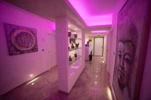 a hallway with a purple lighting in a room at Tropea Luxury & Charm in Tropea