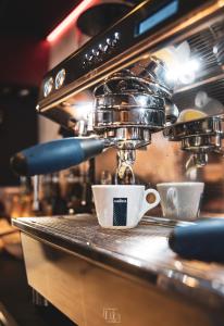 a cup of coffee sitting on a counter at La Forteresse in Borgloon