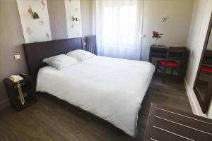 Postel nebo postele na pokoji v ubytování Hotel les Pecheurs