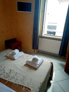 Postel nebo postele na pokoji v ubytování Hotel Ferrari