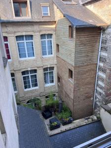 an overhead view of a brick building with a garage at La petite lumière Dieppoise in Dieppe