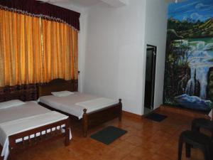 Postel nebo postele na pokoji v ubytování White Elephant Hotel