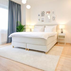 Posteľ alebo postele v izbe v ubytovaní Urban Apartments by Homester