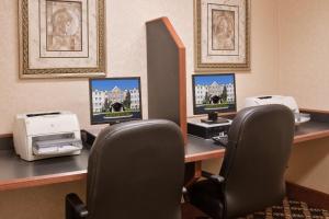 a desk with two computer monitors and two printers at Staybridge Suites Columbus-Dublin, an IHG Hotel in Dublin
