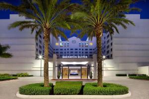two palm trees in front of a building at Sheraton Suites Fort Lauderdale West in Plantation