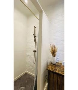a bathroom with white walls and a shower stall at ApartmentInCopenhagen Apartment 1541 in Copenhagen