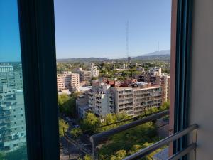 a view of a city from a window at PREMIUM MENDOZA in Mendoza
