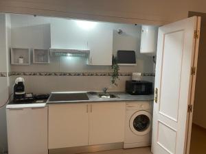 Kuchyň nebo kuchyňský kout v ubytování Apartamento Flores de Santiago
