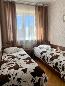 Postel nebo postele na pokoji v ubytování Two-bedroom apartment in central Palanga