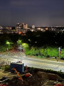a night view of a city with a highway at Executive Luxury stays 3 in Barking