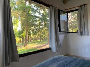 Una cama o camas en una habitación de La Casita del Bosque