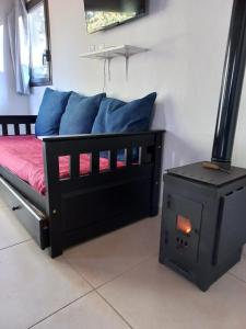 Una cama o camas en una habitación de La Casita del Bosque