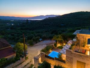 an aerial view of a villa with a swimming pool at Effrosini Traditional Home in Nopíyia