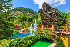 a water park with a waterfall and a water slide at Romanna's all-season getaway at Icicle Village with pool and hot tub in Leavenworth