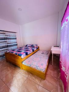 Postel nebo postele na pokoji v ubytování Casa de Huéspedes Playas Arena