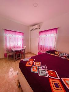 Postel nebo postele na pokoji v ubytování Casa de Huéspedes Playas Arena