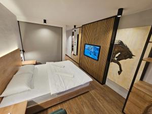Postel nebo postele na pokoji v ubytování Hotel Komovi