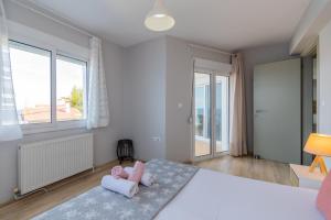 Ένα ή περισσότερα κρεβάτια σε δωμάτιο στο Anesis Seaview Apartment 2