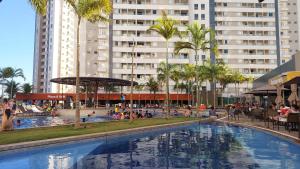 a swimming pool in a resort with people in it at HOTEL Resort 2025 in Olímpia
