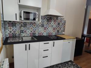 Kuchyň nebo kuchyňský kout v ubytování CASA PEDRASRUBIAS