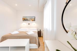Ένα ή περισσότερα κρεβάτια σε δωμάτιο στο ARIA Sea View Apartment