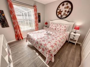 a small bedroom with a bed and a window at Mickey Funhouse, Pool, Fenced , Pets, Games in Orlando