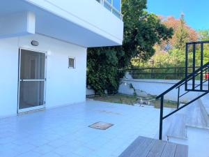 a patio with a staircase and a white building at Alma Resorts Studio in Rhodes Town