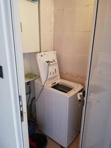 a washing machine sitting inside of a small room at Ferienwohnung mit Meerblick! in Sveti Vlas