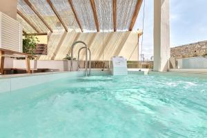 The swimming pool at or close to 2 bedroom Villa with heated swimming pool-Spa whirlpool-BBQ!