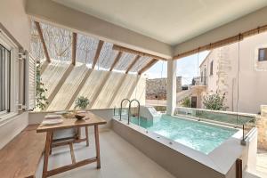 The swimming pool at or close to 2 bedroom Villa with heated swimming pool-Spa whirlpool-BBQ!